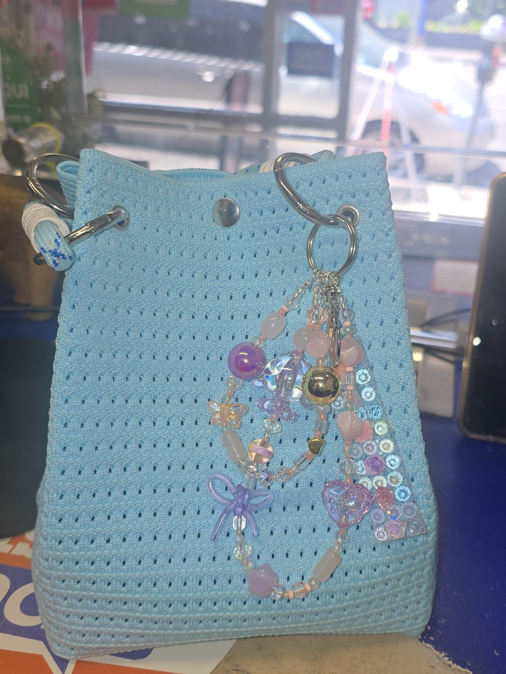 Light Blue Crochet Drawstring Bag with Beaded Charm
